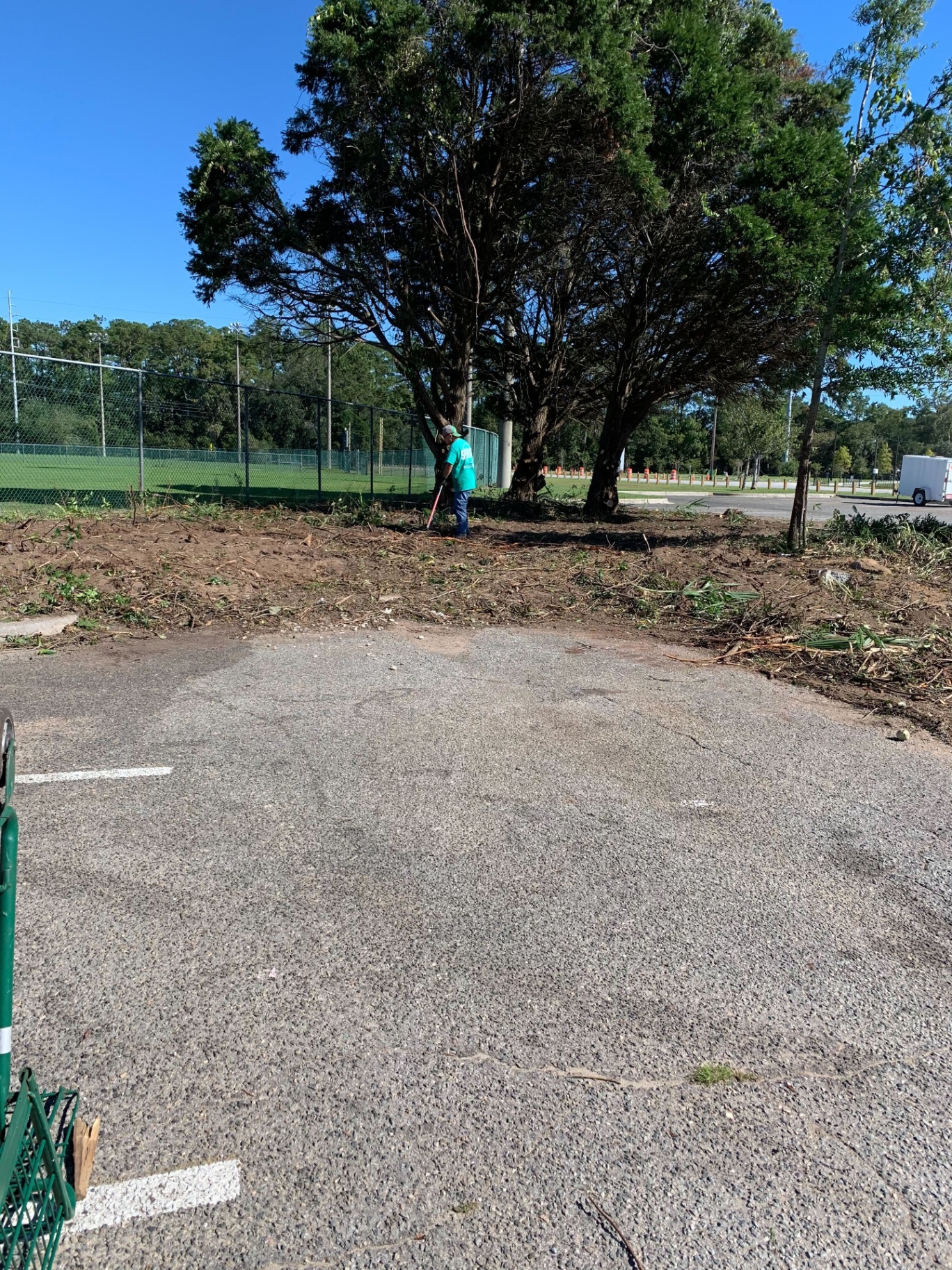 Sam-Jay crew member clearing brush at a municipal facility