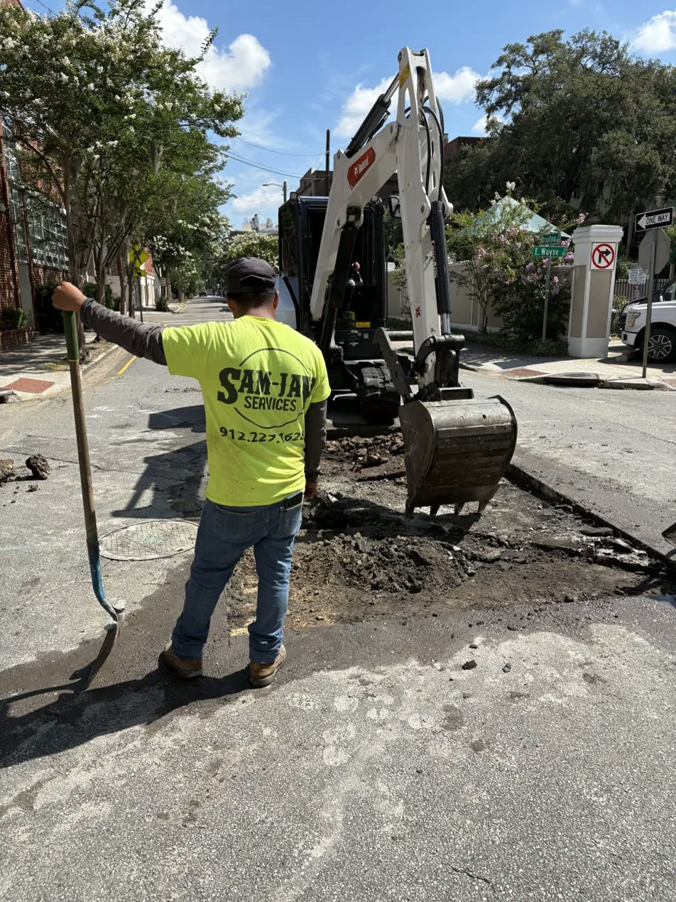 Sam-Jay Services crew opening a street utility cut in downtown Savannah, Georgia